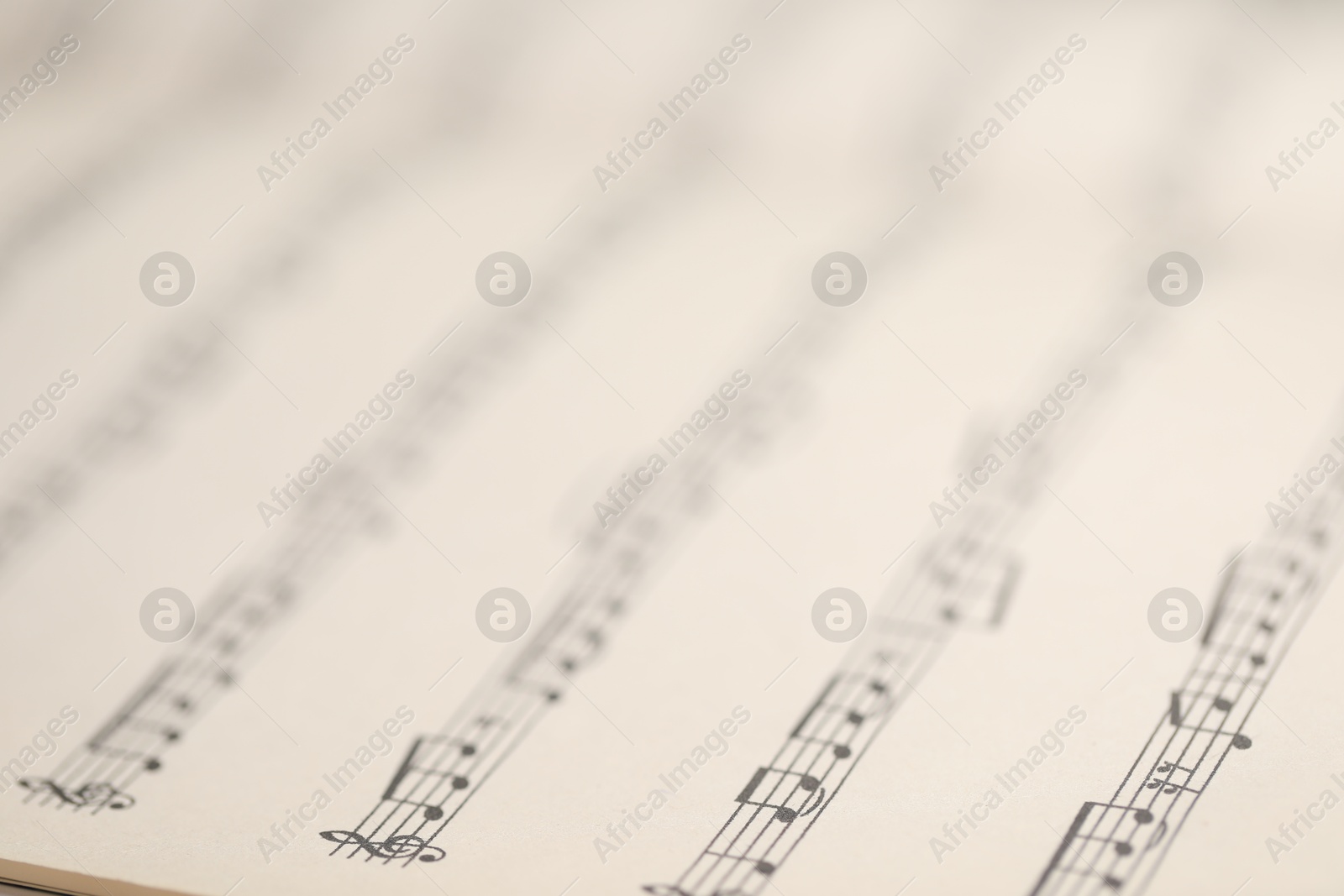 Sheet with musical notes as background, closeup Photo of Sheet with musical notes as background, closeup