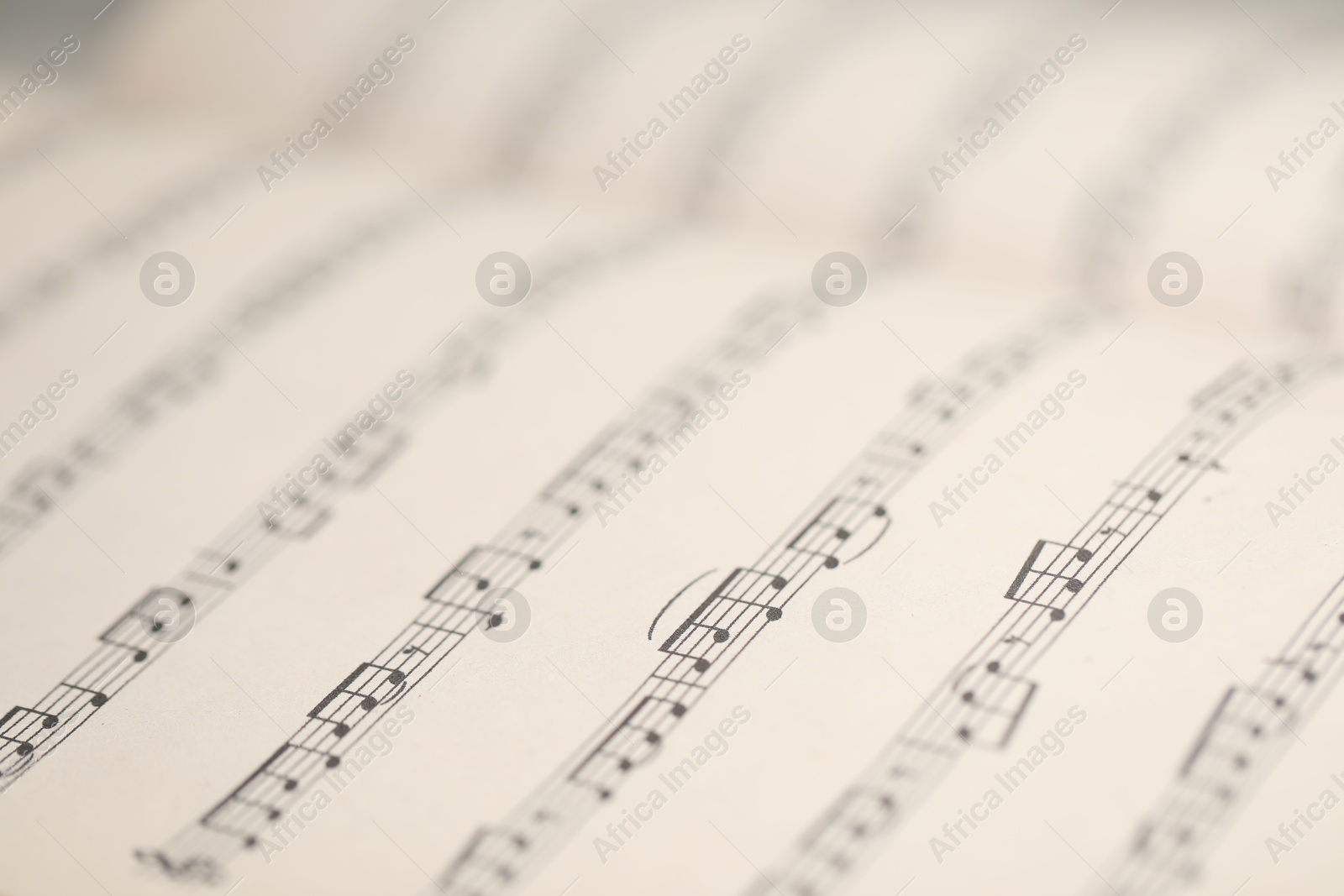 Sheets with musical notes as background, closeup Photo of Sheets with musical notes as background, closeup
