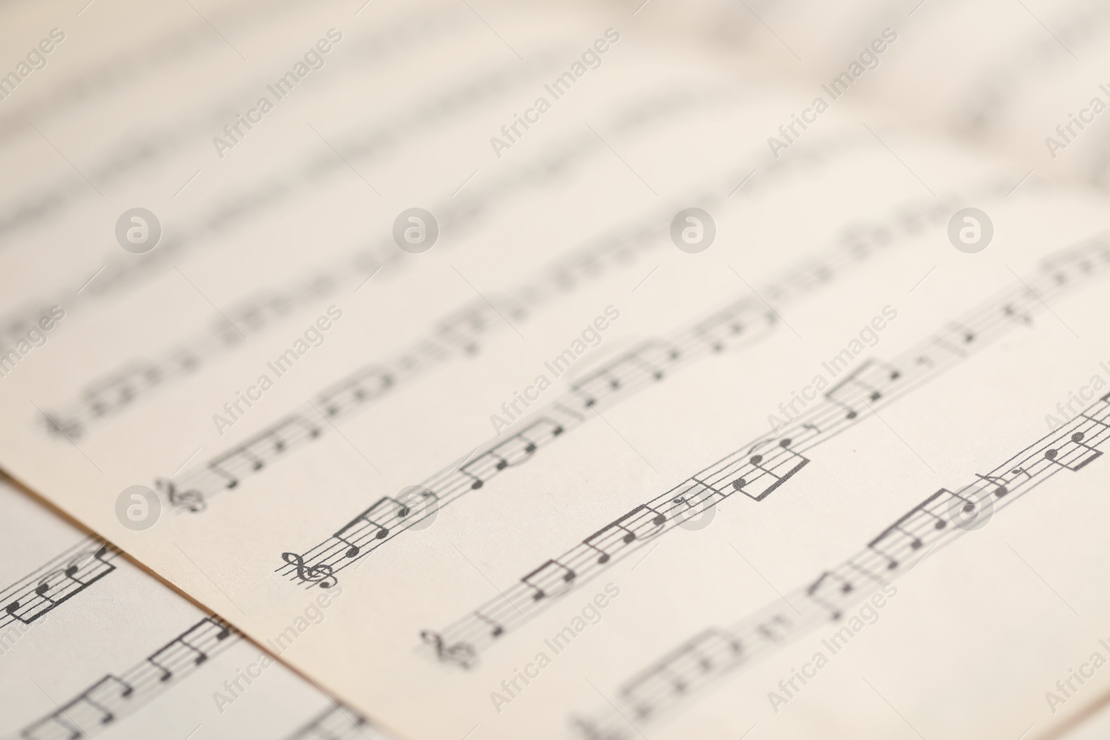 Sheets with musical notes as background, closeup Photo of Sheets with musical notes as background, closeup