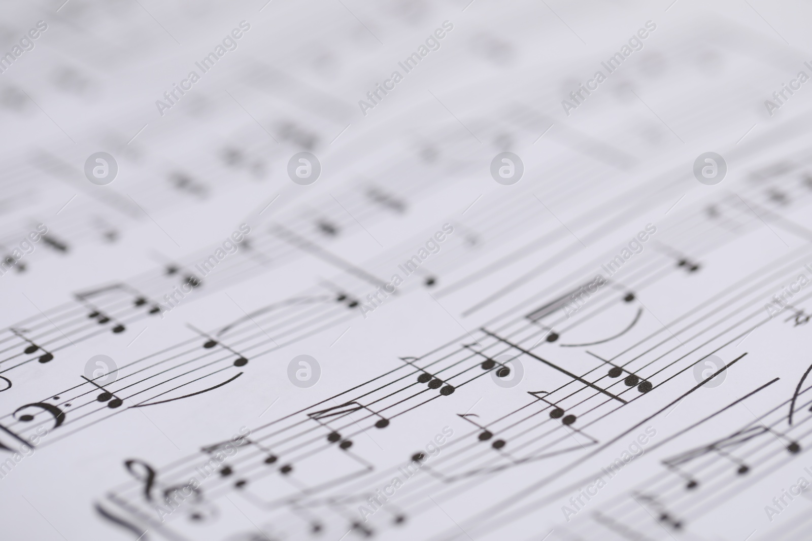 Sheet with musical notes as background, closeup Photo of Sheet with musical notes as background, closeup