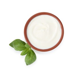 Photo of Tasty yoghurt in bowl and basil isolated on white, top view