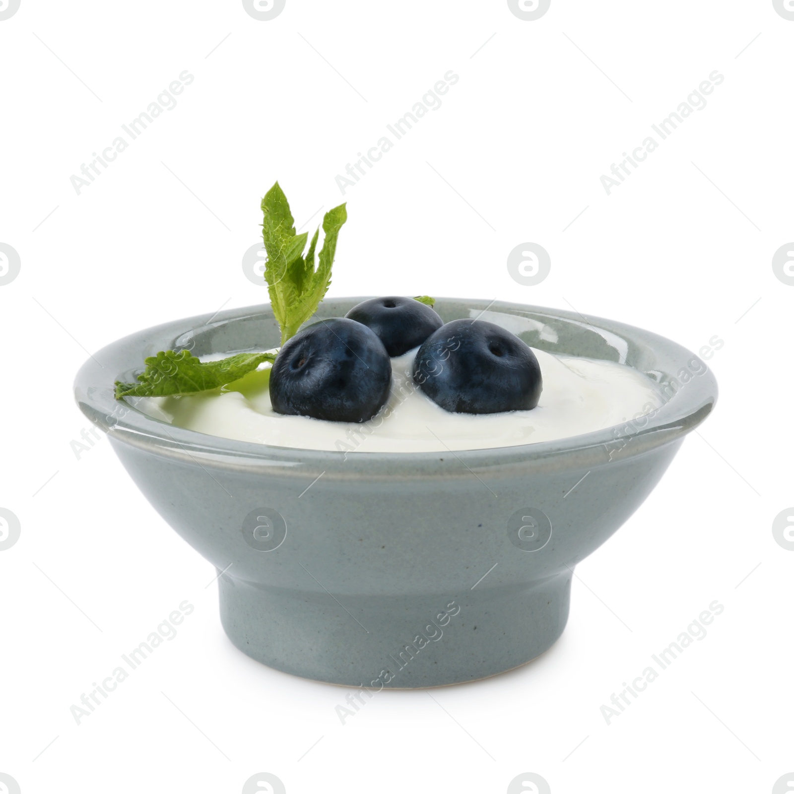 Tasty yoghurt with blueberries and mint in bowl isolated on white Photo of Tasty yoghurt with blueberries and mint in bowl isolated on white