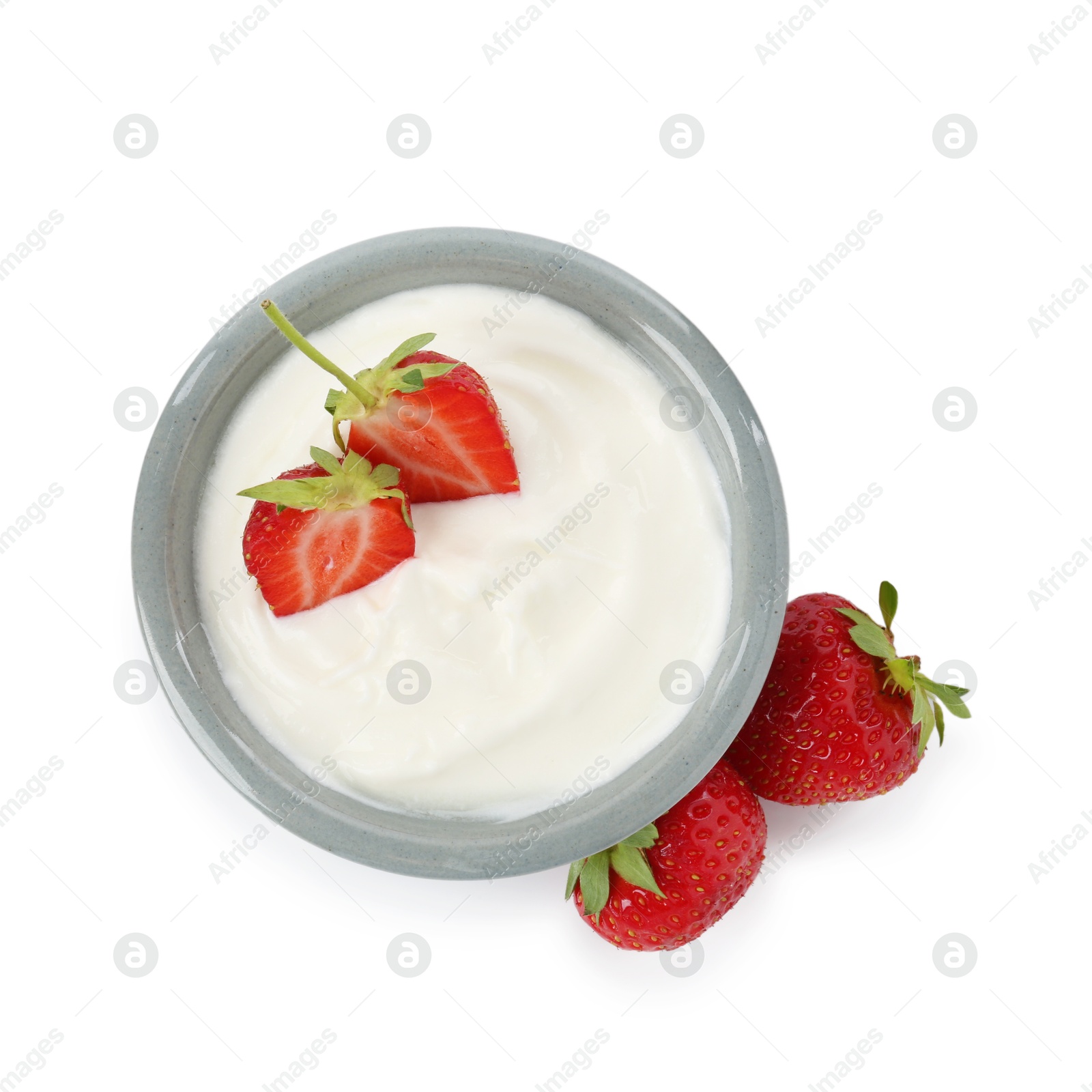 Photo of Tasty yoghurt with strawberries in bowl isolated on white, top view