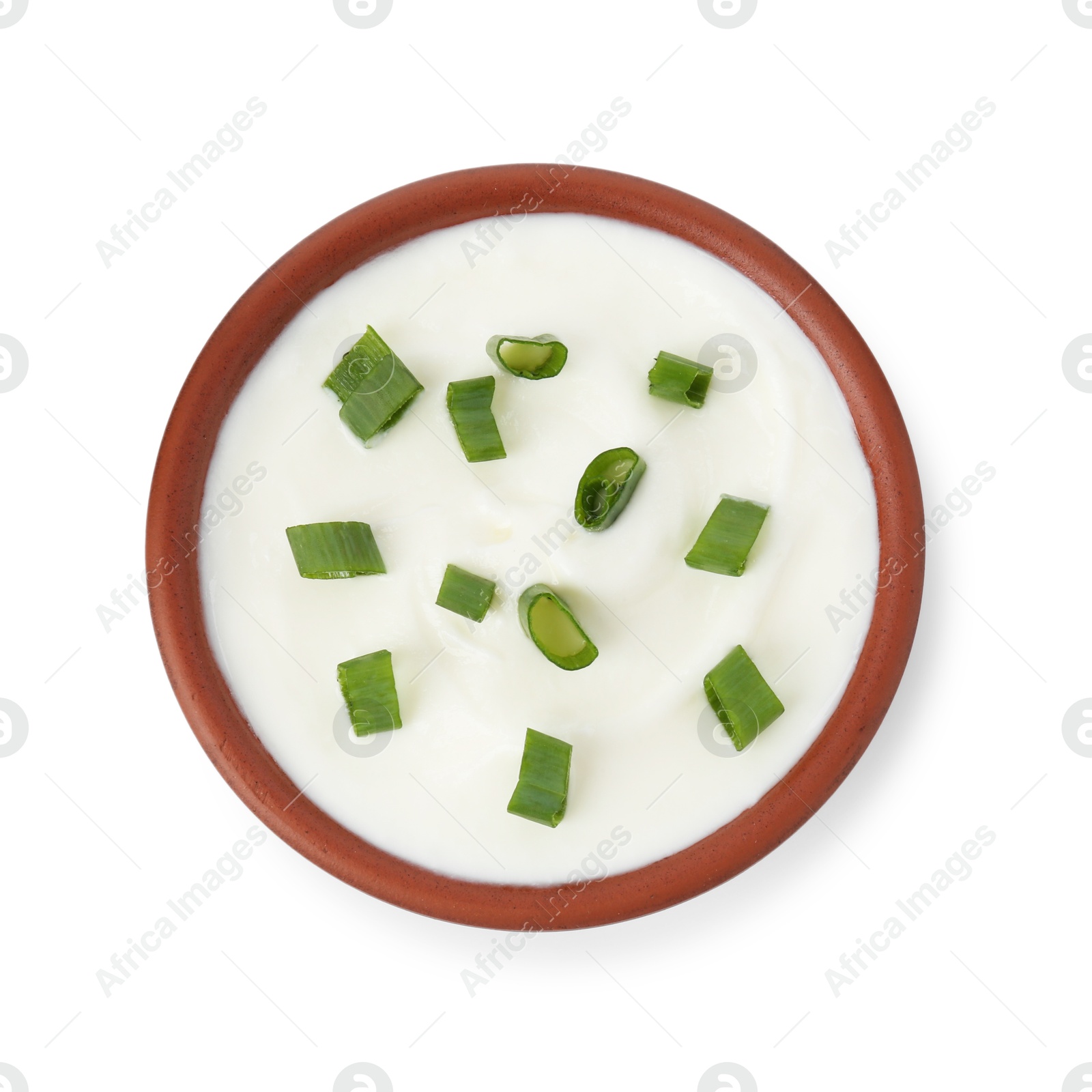 Tasty yoghurt with green onions in bowl isolated on white, top view Photo of Tasty yoghurt with green onions in bowl isolated on white, top view