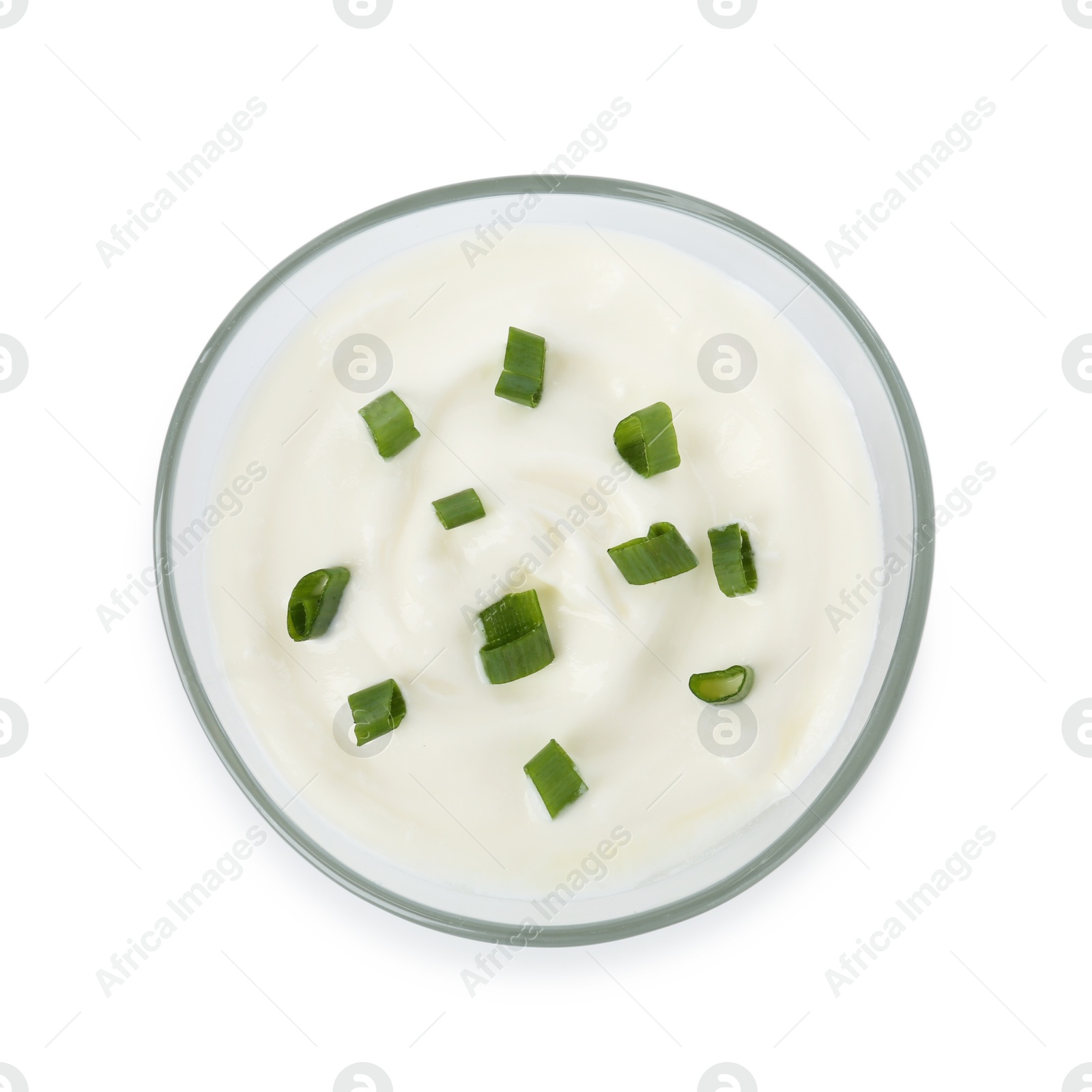 Photo of Tasty yoghurt with green onions in bowl isolated on white, top view