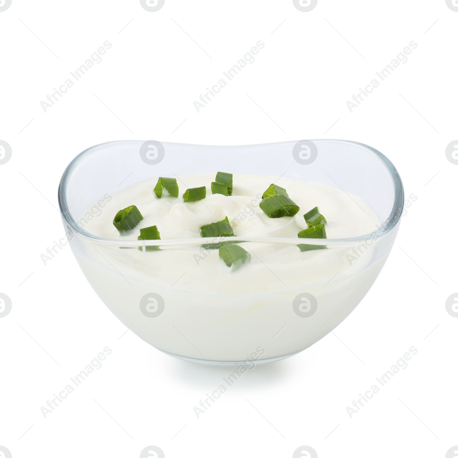 Photo of Tasty yoghurt with green onions in bowl isolated on white