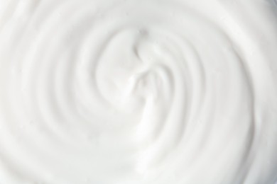 Photo of Texture of tasty yogurt as background, top view