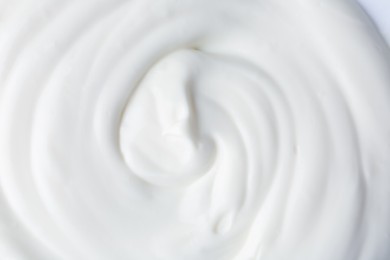 Photo of Texture of tasty yogurt as background, top view