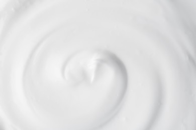 Photo of Texture of tasty yogurt as background, top view