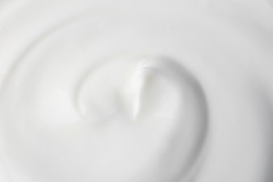 Photo of Texture of tasty yogurt as background, top view