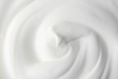 Photo of Texture of tasty yogurt as background, top view