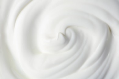 Photo of Texture of tasty yogurt as background, top view