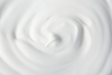 Photo of Texture of tasty yogurt as background, top view