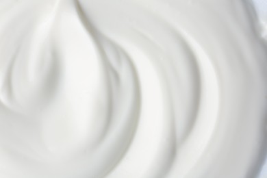 Photo of Texture of tasty yogurt as background, top view