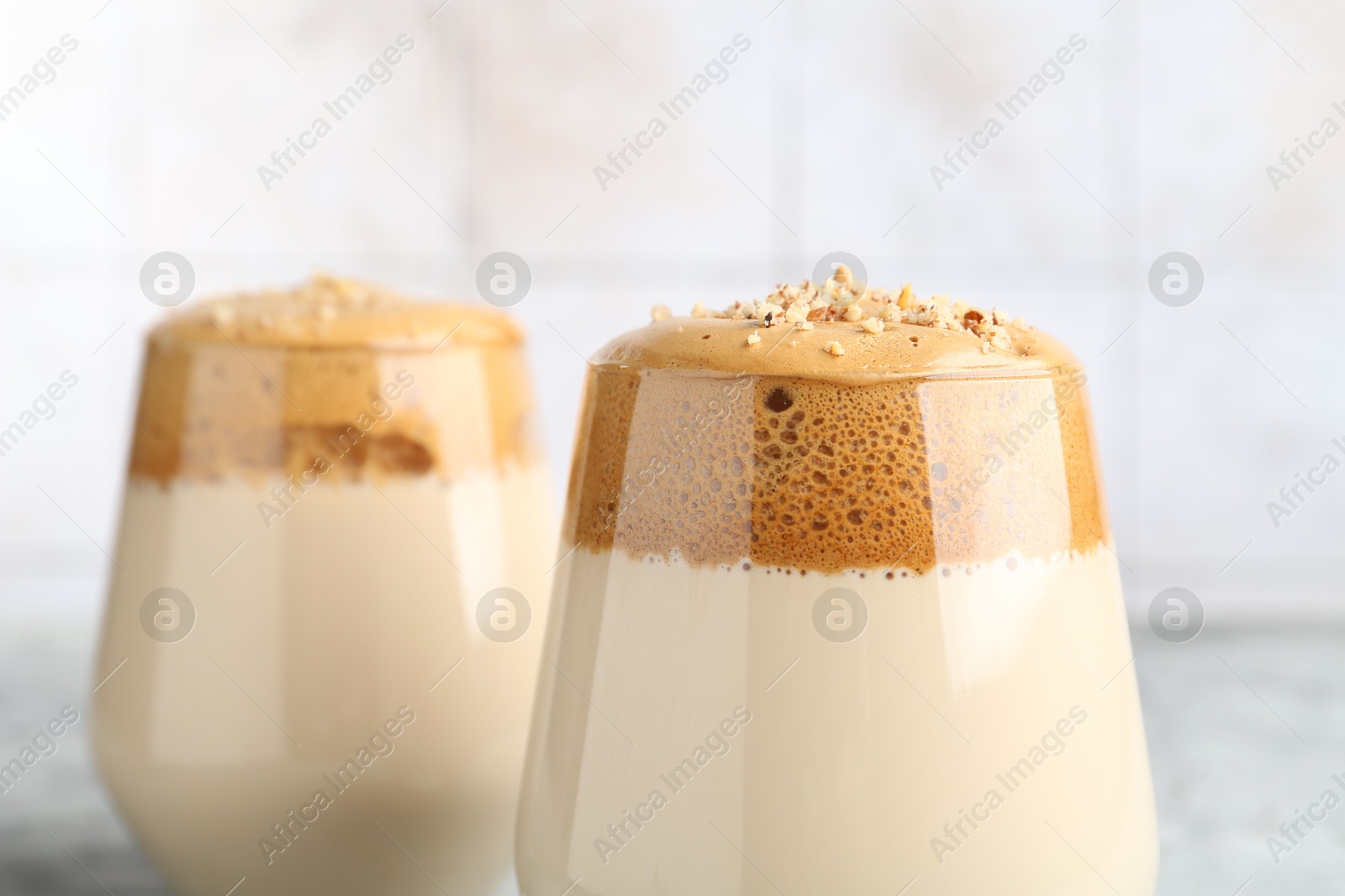 Delicious dalgona coffee in glasses on table, closeup Photo of Delicious dalgona coffee in glasses on table, closeup