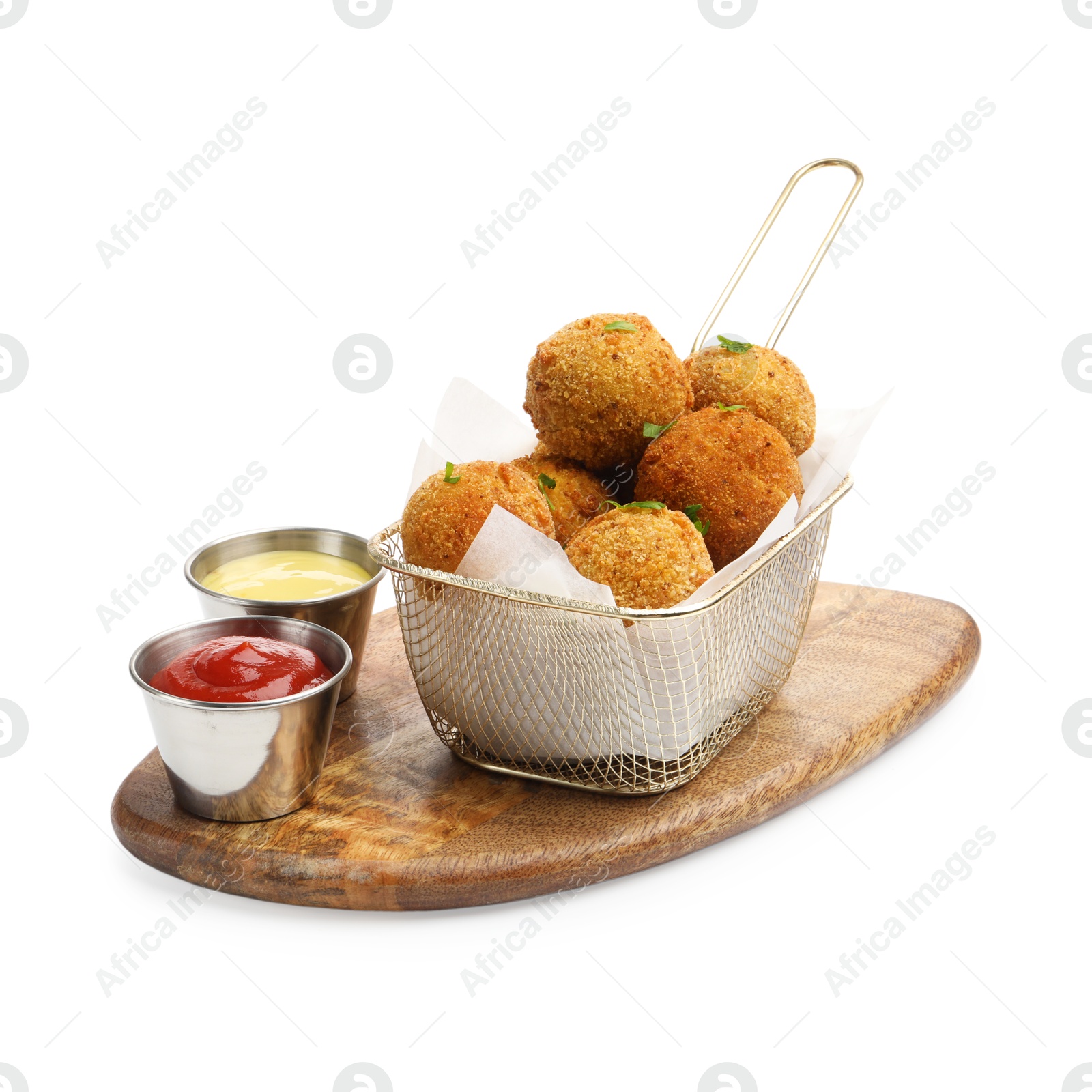 Delicious fried croquette balls with parsley and sauces isolated on white Photo of Delicious fried croquette balls with parsley and sauces isolated on white