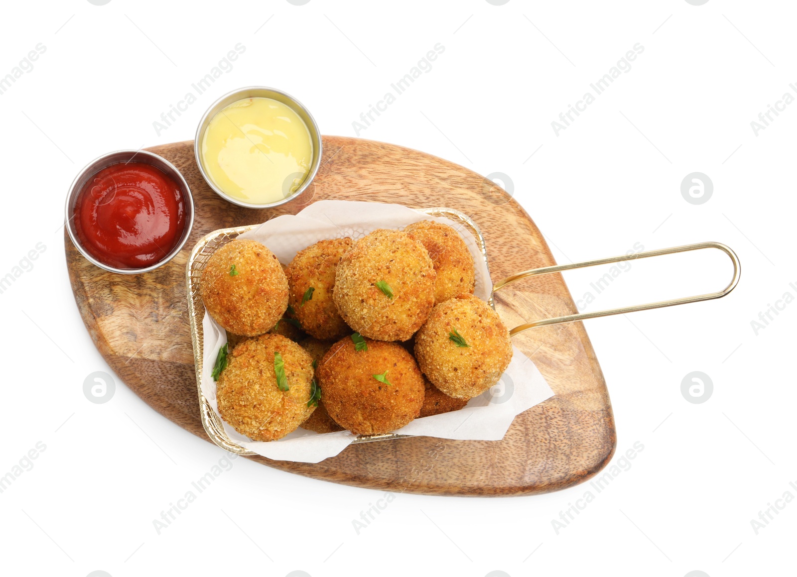 Delicious fried croquette balls with parsley and sauces isolated on white, top view Photo of Delicious fried croquette balls with parsley and sauces isolated on white, top view
