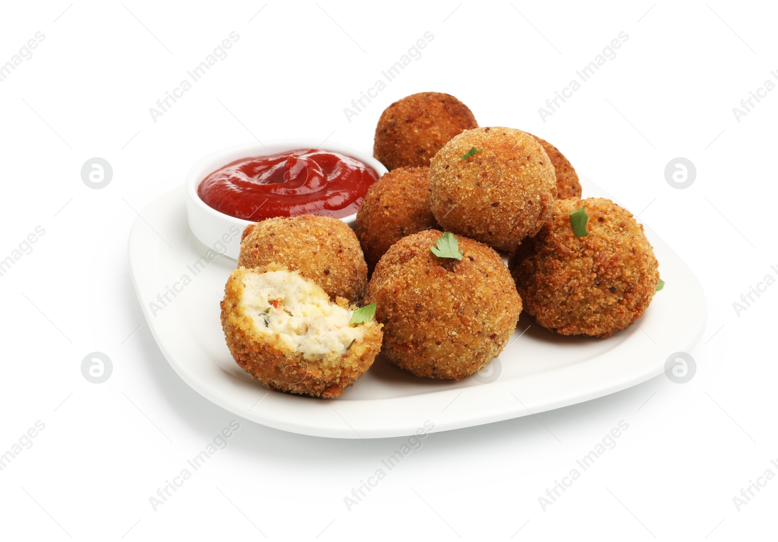 Delicious fried croquette balls with parsley and ketchup isolated on white Photo of Delicious fried croquette balls with parsley and ketchup isolated on white