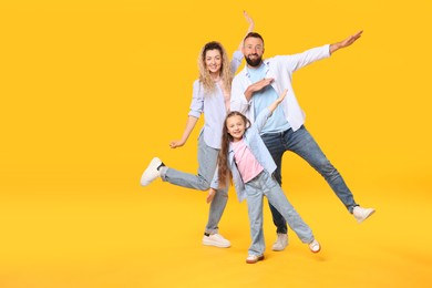 Photo of Happy family on yellow background. Space for text