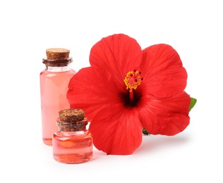 Photo of Beautiful red hibiscus flower and cosmetic products isolated on white