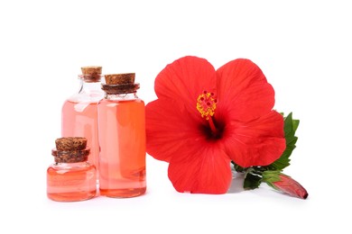 Photo of Beautiful red hibiscus flower and cosmetic products isolated on white