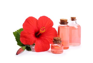 Photo of Beautiful red hibiscus flower and cosmetic products isolated on white