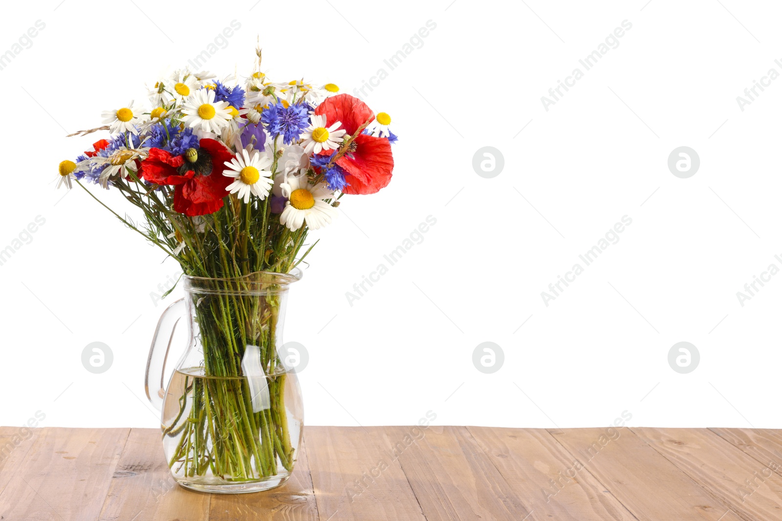 Photo of Beautiful wildflowers in vase on wooden table against white background