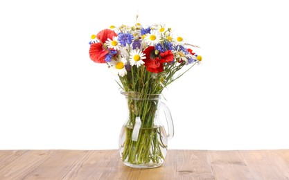 Photo of Beautiful wildflowers in vase on wooden table against white background