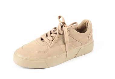 Photo of One stylish beige sneaker on white background