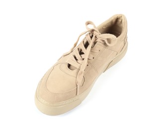 Photo of One stylish beige sneaker on white background