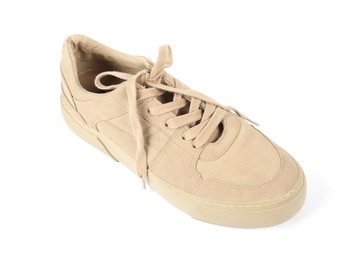 Photo of One stylish beige sneaker on white background