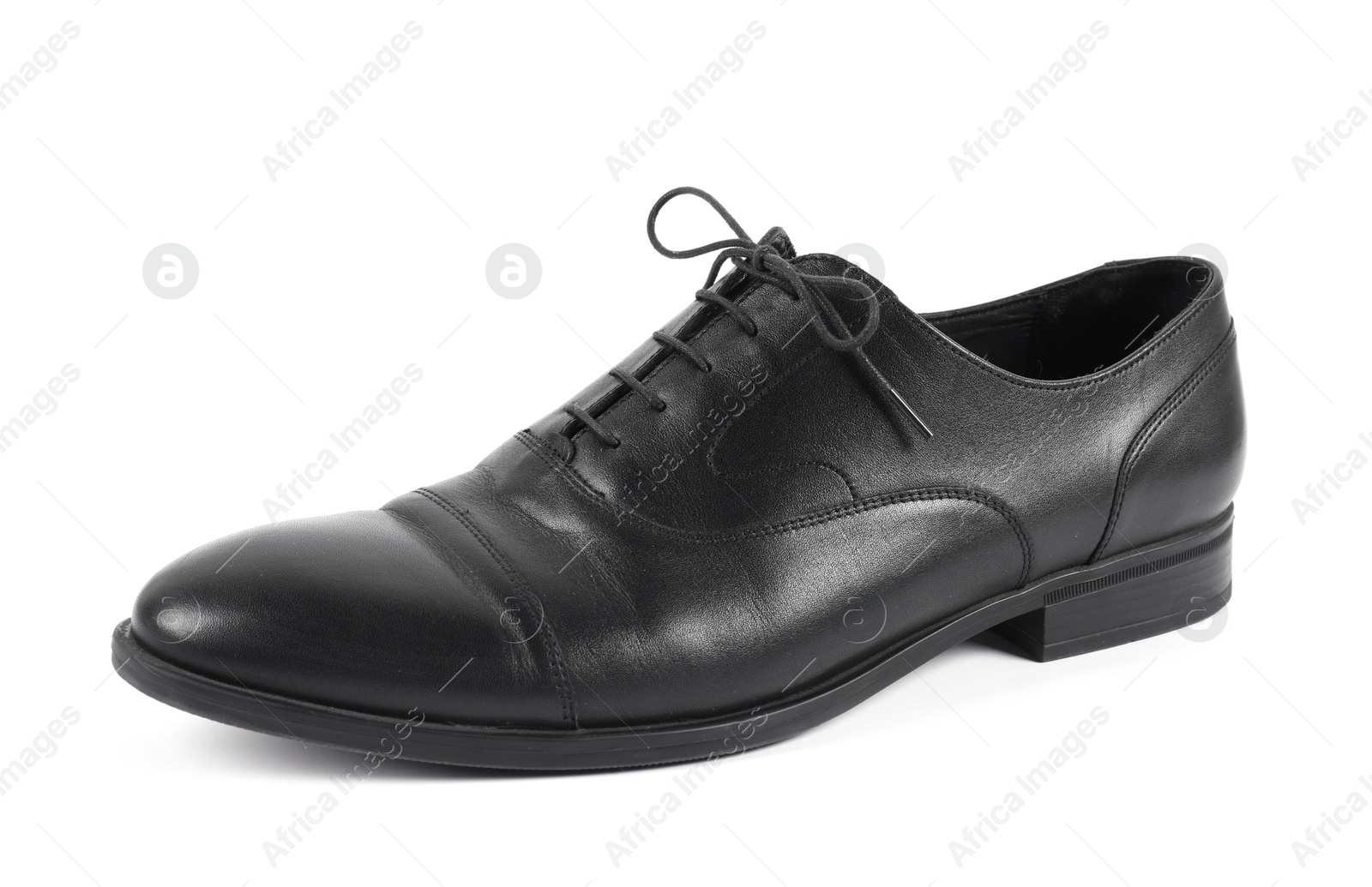 Photo of One black leather shoe on white background