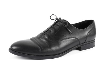 Photo of One black leather shoe on white background