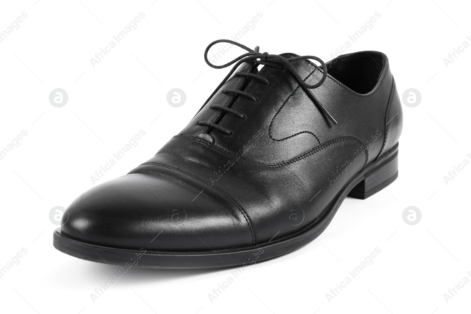 Photo of One black leather shoe on white background