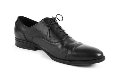 Photo of One black leather shoe on white background