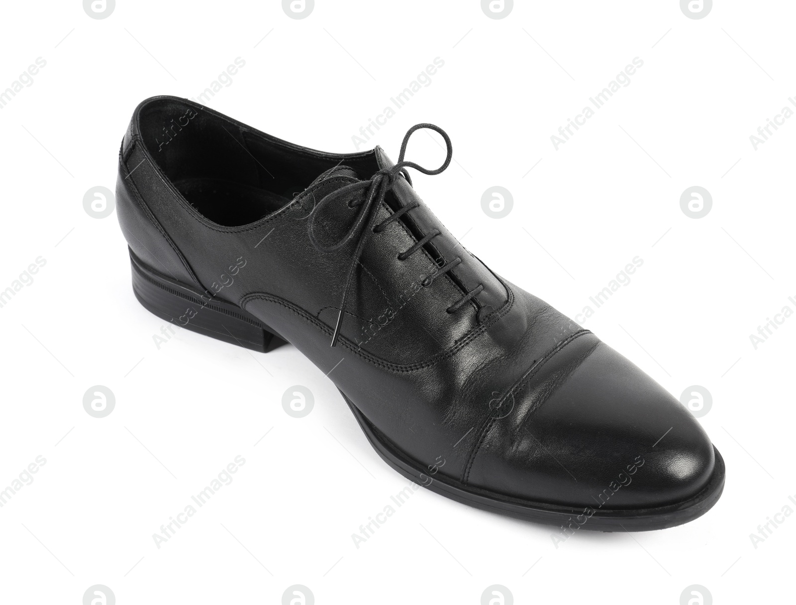 Photo of One black leather shoe on white background