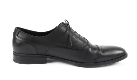 Photo of One black leather shoe on white background