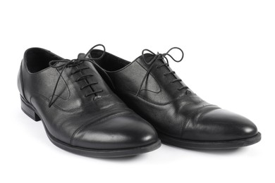 Photo of Pair of black leather shoes on white background