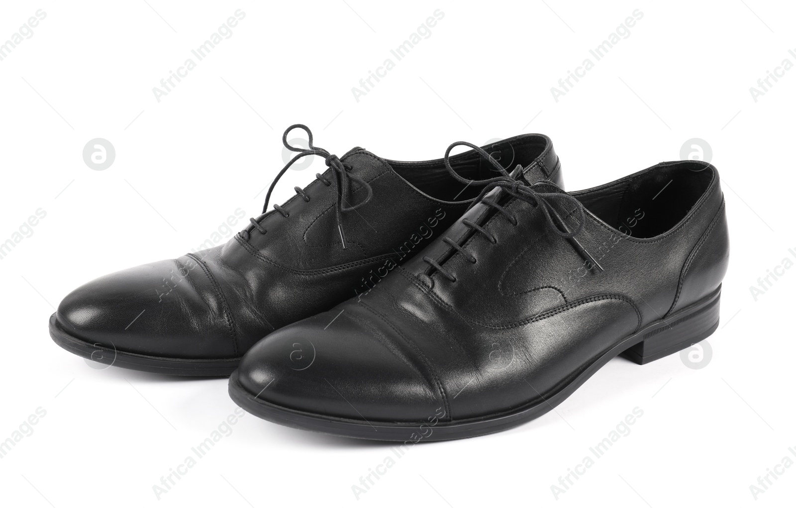 Photo of Pair of black leather shoes on white background