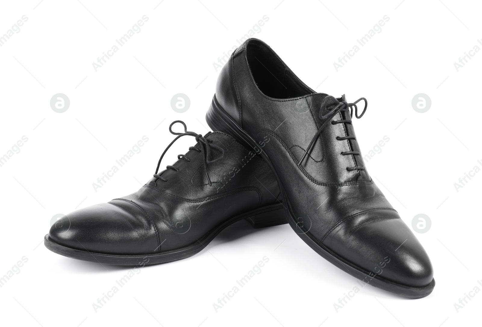 Photo of Pair of black leather shoes on white background