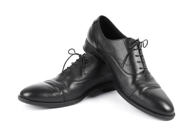 Photo of Pair of black leather shoes on white background