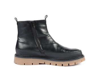 Photo of One stylish black boot on white background