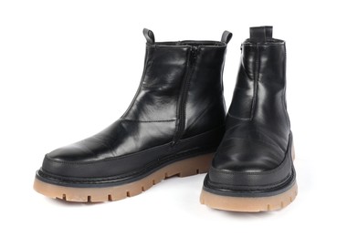 Photo of Pair of stylish black boots on white background