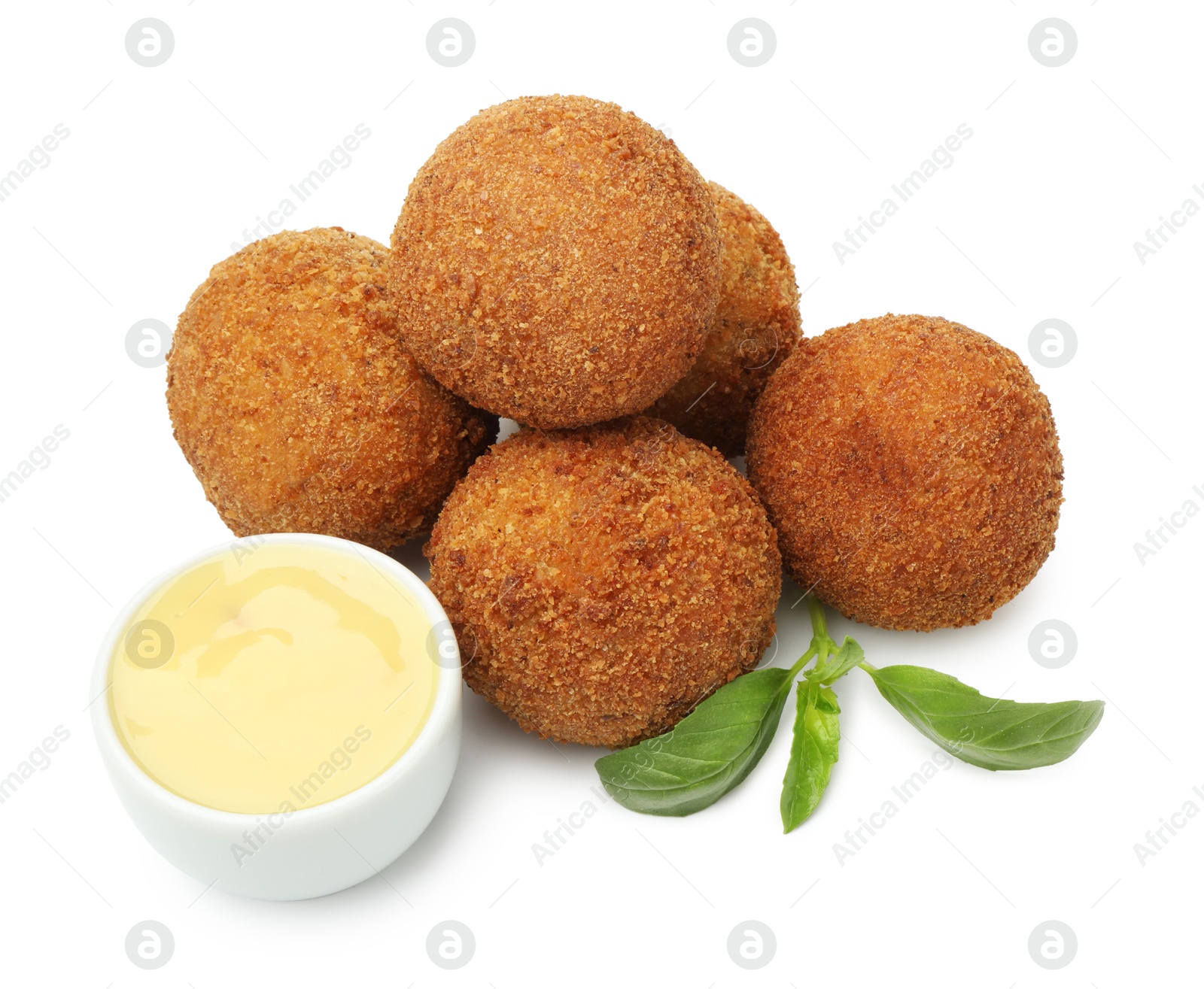 Delicious fried croquette balls, sauce and basil isolated on white Photo of Delicious fried croquette balls, sauce and basil isolated on white