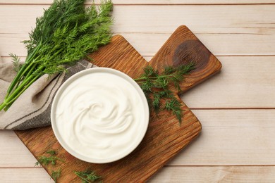 Photo of Tasty sour cream and dill on white wooden table, flat lay