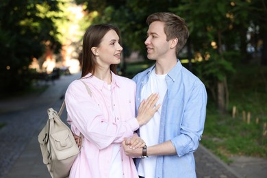 Photo of Lovely couple walking together on city street