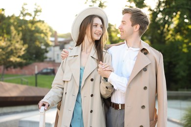 Photo of Lovely couple walking together on city street