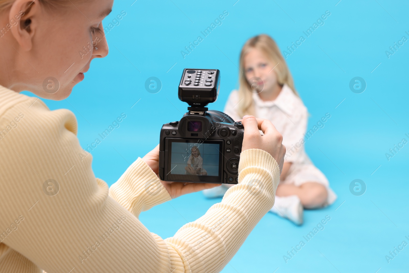 Photographer working with model in professional photo studio, selective focus Photo of Photographer working with model in professional photo studio, selective focus