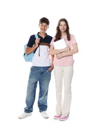 Photo of Teenage girl and boy with backpack and laptop on white background