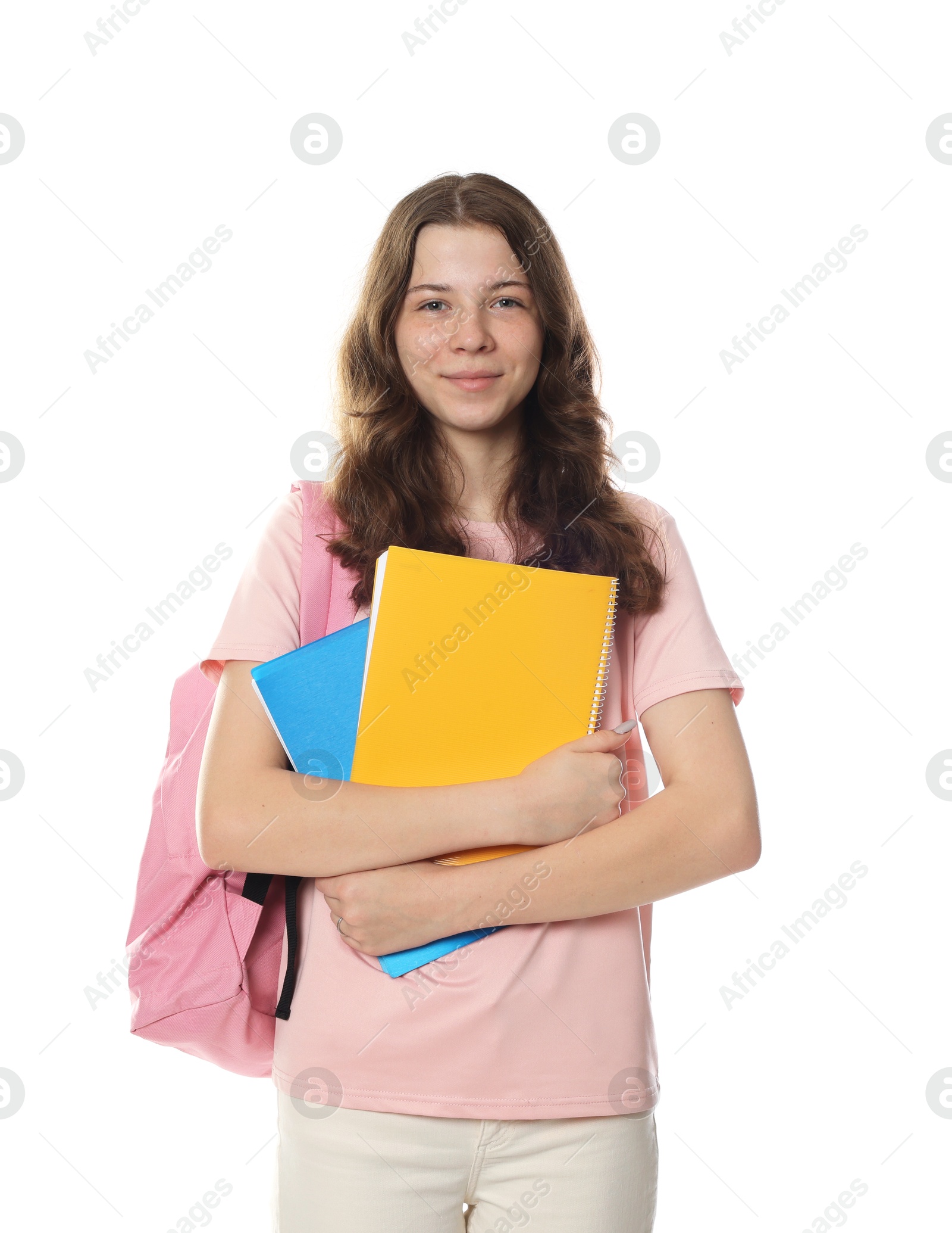 Cute teenage girl with backpack and notebooks on white background Photo of Cute teenage girl with backpack and notebooks on white background